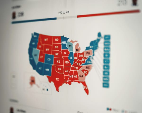 A photograph of a screen showing the state-by-state election results on a US map